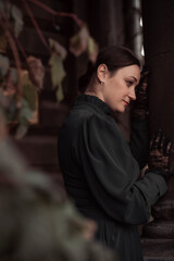 Woman in a vintage dress. Portrait of a woman in the park.