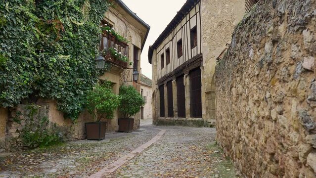 Beautiful narrow streets with tunnels leading to other streets in the town of Pedraza, Segovia, Spain.