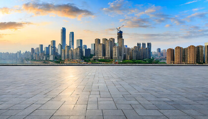 empty floor and city skyline with modern buildings at sunrise in chongqing china