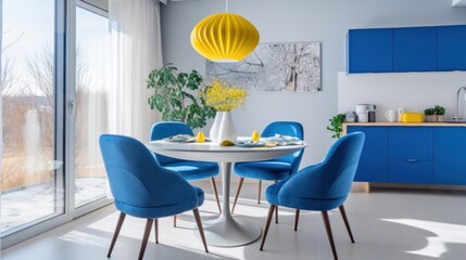 Dining room interior design in a contemporary, light-filled apartment with a blue table and chairs