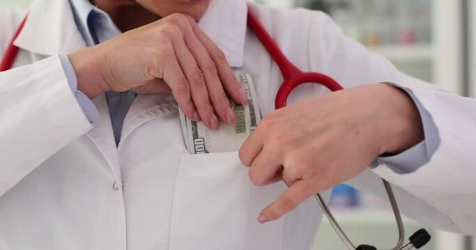 General practitioner hides bribe in pocket in clinic