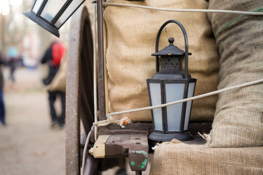 carnival carriage with sacks of coal and a lighthouse lantern. costume festival
