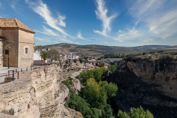 Fototapeta na wymiar View of the houses on the cliffs of Alhama de Granada (Spain), also known for its hot springs