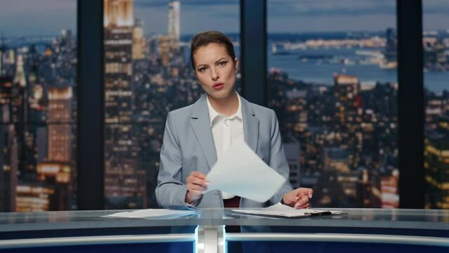Serious anchorwoman talking news at evening studio closeup. Woman host speaking