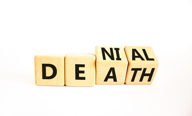 Denial death symbol. Concept words Denial Death on wooden block. Beautiful white table white background. Business denial death concept. Copy space.