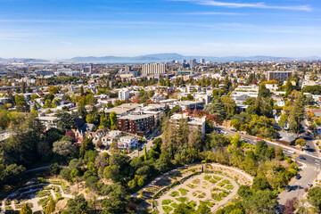 Aerial images over the hills of Oakland, California with a community of apartments on a beautiful...
