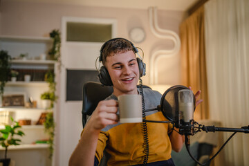 man shooting or streaming video podcast or vlogg blogger at studio