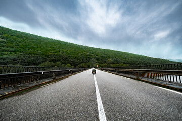 unrecognizable man documents tranquil autumn scene.