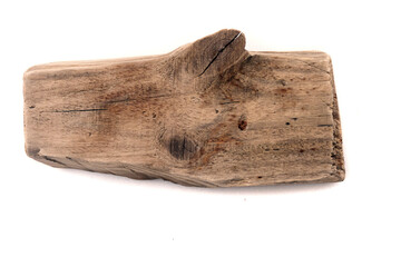 A wooden stick turned by the sea, driftwood on a white background