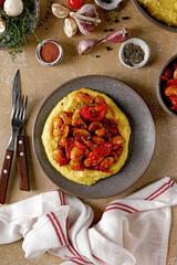 Stew with Butter beans, mushrooms and tomato sauce served with polenta, vegetarian dish, top view