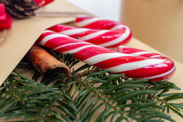 Christmas, New Year gifts. Presents. Beautiful boxes, ribbons and decorations. tree cones on white background. red. craft paper. Holiday. original. cinnamon. candy. Package Design