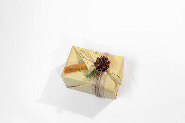 Christmas, New Year gifts. Presents. Beautiful boxes, ribbons and decorations. tree cones on white background. red. craft paper. Holiday. original. cinnamon. candy. Package Design