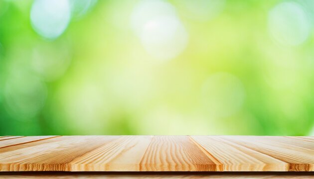 Wood desk top with nature green blur background. Empty plank wooden table for your products