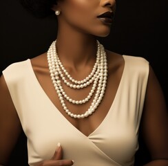 a woman holding a pearl necklace