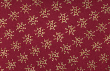 Naklejka na ściany i meble Elegant golden snowflakes on a festive red background