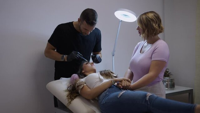 Brunette girl complains of pain from being pricked