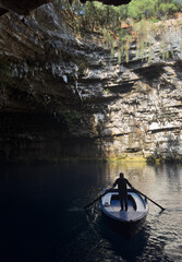 A man in a cave on a boat. Ithaca Greece