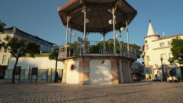 Faro city center Manuel Bivar garden overlooking the historic bandstand, people are walking by pavers. Faro Portugal