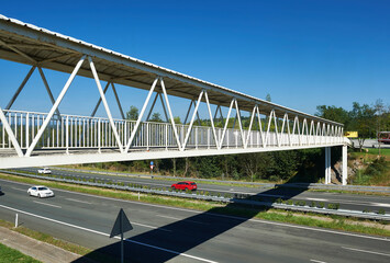 pedestrian walkway over the A8 Cantabrian highway with three lanes in each direction 