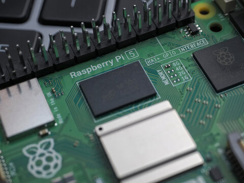 Galati, ROMANIA - November 10, 2023: Close-up of a Raspberry Pi 5 with Active Cooler on a laptop keyboard. The Raspberry Pi is a credit-card-sized single-board computer developed in the UK