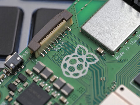 Galati, ROMANIA - November 10, 2023: Close-up of a Raspberry Pi 5 with Active Cooler on a laptop keyboard. The Raspberry Pi is a credit-card-sized single-board computer developed in the UK