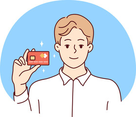 Smiling man posing with bank card