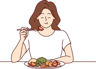 Woman eats appetizing fresh vegetable salad and closes eyes, enjoying delicious and healthy diet