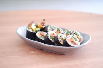 Sushi roll japanese food style on wooden table background.