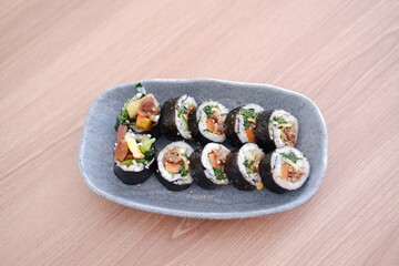 Sushi roll japanese food style on wooden table background.
