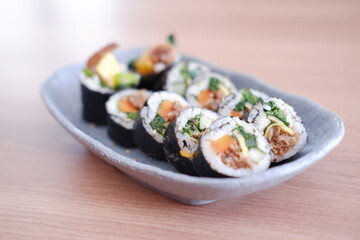 Sushi roll japanese food style on wooden table background.
