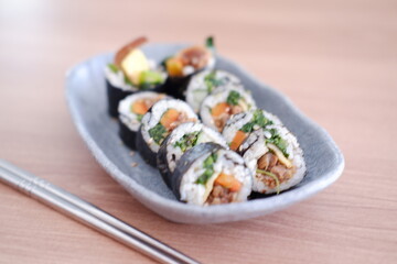 Sushi roll japanese food style on wooden table background.