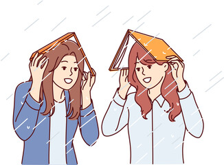 Women take shelter from rain under books and smile, rejoicing at onset of autumn season