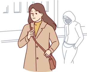 Woman walking through city at night notices stalker who wants to attack or rob defenseless girl
