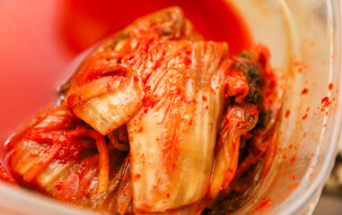 Korean kimchi, a fiery and flavorful delicacy, in colorful jars, showcasing its cultural richness