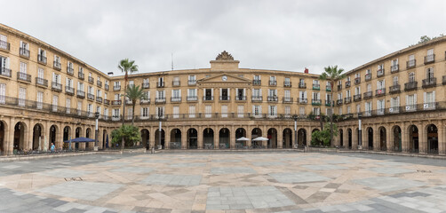Fototapeta na wymiar Panoramic view of Plaza Barra or Plaza Nueva, a neoclassical square in the historic area of Casco Viejo, downtown Bilbao, Spain