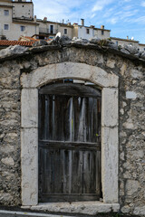 Old vintage door in Civitella Alfedena, Abruzzo, small village in Italy in the autumn, concept of tranquility and relax.