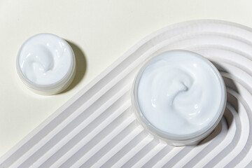 Moisturizing facial cream with peptides and microelements against skin aging.