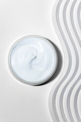 Moisturizing facial cream with peptides and microelements against skin aging.
