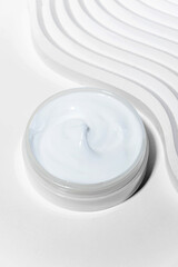 Moisturizing facial cream with peptides and microelements against skin aging.