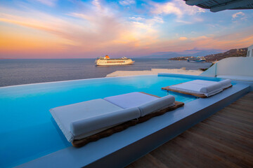 Infinity pool with cruise at sunrise, Mykonos, Greece - obrazy, fototapety, plakaty