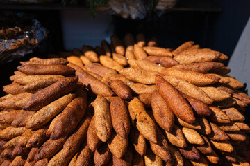 Traditional Turkish Stuffed Meatballs (Kibbeh) at a Market. Golden Brown Heap of Kibbeh for Sale at a Bazaar. Turkish Dish, cuisine. Street food