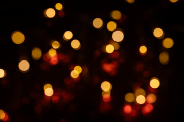 Defocused red and yellow lights background, Christmas decorative lights, bokeh