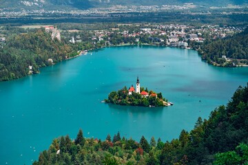 Drone shot of the Assumption of Mary church on the island of Bled lake in Slovenia