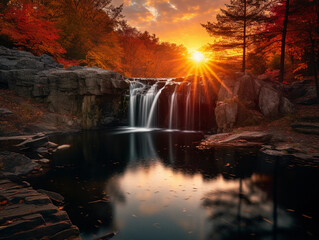 Double waterfall merging into a single pool, surrounded by autumn foliage