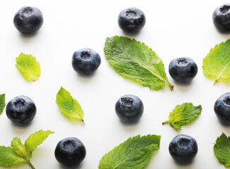 Blueberrys and mint on white background.