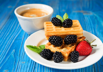 Waffles with blackberries and raspberries for breakfast
