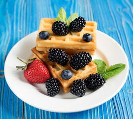 Waffles with blackberries and raspberries for breakfast