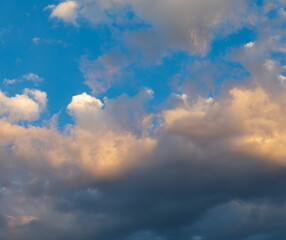 Fototapeta na wymiar Idyllic sky with clouds of different shapes