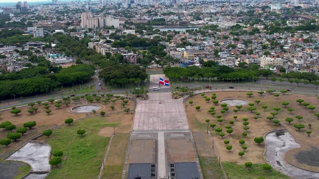 Aerial cinematic footage of the beautiful Columbus Lighthouse monument and the flag of Dominican Republic in Santo Domingo