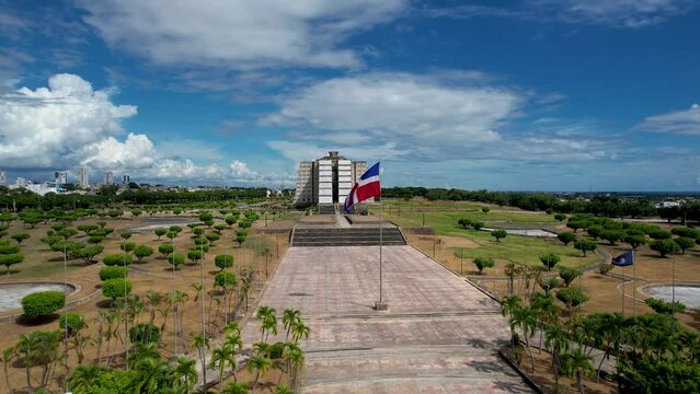 Aerial cinematic footage of the beautiful Columbus Lighthouse monument and the flag of Dominican Republic in Santo Domingo